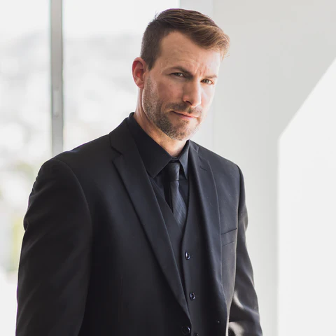 Matthew in a black suit
